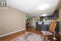 Kitchen with stainless steel appliances and a  breakfast bar as viewed from living room. - 