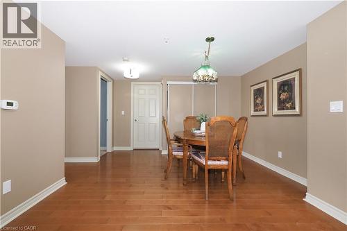 Dining area with classic hardwood  flooring - 645 St. David Street S Unit# 412, Fergus, ON - Indoor Photo Showing Dining Room