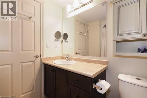 Bathroom vanity with pull out drawers and single sink. - 645 St. David Street S Unit# 412, Fergus, ON - Indoor Photo Showing Bathroom