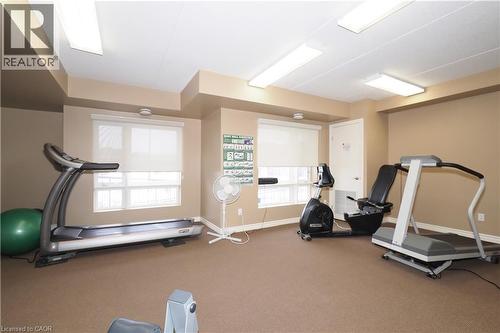 View of workout area on building's main floor - 645 St. David Street S Unit# 412, Fergus, ON - Indoor Photo Showing Gym Room
