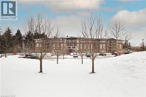 View of building from centre courtyard area - 645 St. David Street S Unit# 412, Fergus, ON - Outdoor With View
