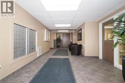 View of Lobby / Foyer Common area featuring a drop ceiling - 