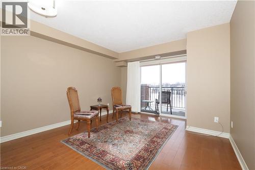 Living area with classic hardwood floors. - 645 St. David Street S Unit# 412, Fergus, ON - Indoor Photo Showing Other Room