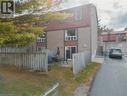 Back of house featuring a patio and brick siding - 