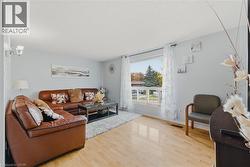 Living area featuring wood finished floors and baseboards - 