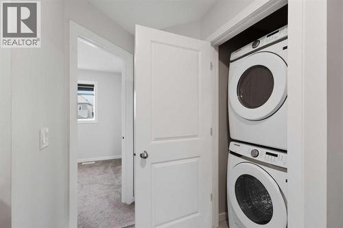 61 Savanna Link Ne, Calgary, AB - Indoor Photo Showing Laundry Room