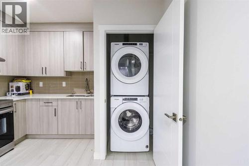 61 Savanna Link Ne, Calgary, AB - Indoor Photo Showing Laundry Room