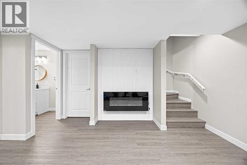 Basement Living Room - 80 Wolf Gate, Okotoks, AB - Indoor Photo Showing Other Room