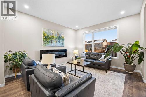Living Room - 80 Wolf Gate, Okotoks, AB - Indoor Photo Showing Living Room With Fireplace