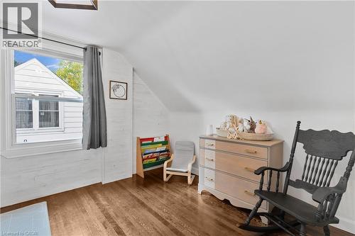 Sitting room featuring lofted ceiling and wood finished floors - 191 East 11Th Street, Hamilton, ON - Indoor Photo Showing Other Room
