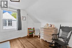 Sitting room featuring lofted ceiling and wood finished floors - 
