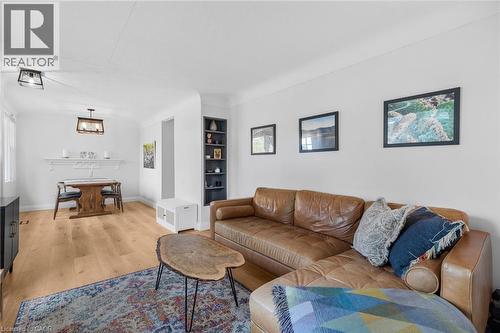 Living area featuring light wood-style floors and baseboards - 191 East 11Th Street, Hamilton, ON - Indoor Photo Showing Living Room