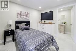 Bedroom with light marble finish flooring and recessed lighting - 