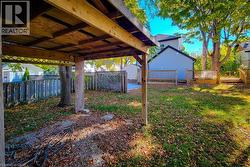 Fenced backyard featuring a wooden deck - 