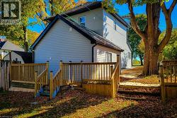 Back of property featuring a wooden deck - 