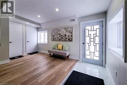 Entrance foyer with recessed lighting and light marble finish flooring - 
