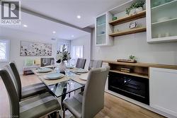 Dining room featuring light wood-style floors and recessed lighting - 