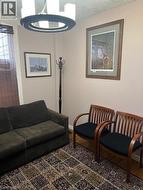 Living room featuring a textured ceiling - 