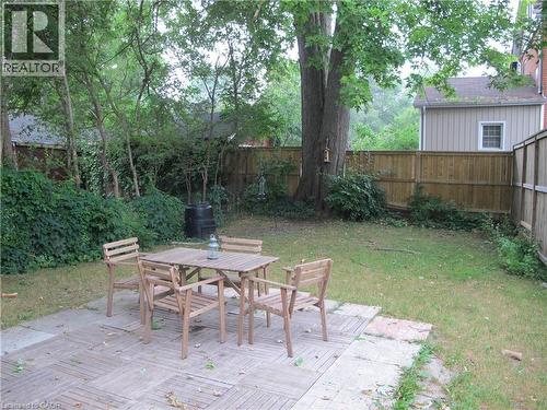 Fenced backyard featuring outdoor dining space and a deck - 37 Dundas Street, Dundas, ON - Outdoor With Backyard