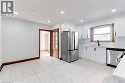 Kitchen w/ Stainless Steel Appliances & Built-in Cabinet - 