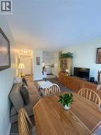 Dining room featuring ceiling fan and baseboards - 