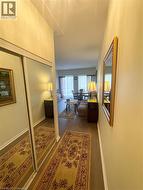 Corridor with baseboards and wood finished floors - 