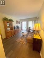 Living area featuring dark wood-style floors - 