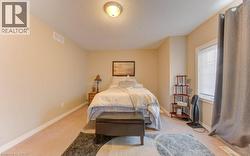 Bedroom featuring carpet flooring and a textured ceiling - 