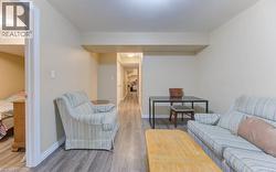 Living room with wood finished floors and baseboards - 