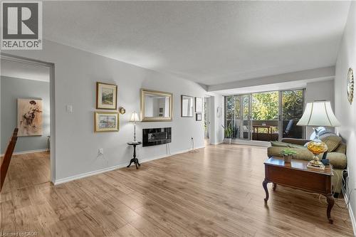 1201 North Shore Boulevard E Unit# 302, Burlington, ON - Indoor Photo Showing Living Room With Fireplace