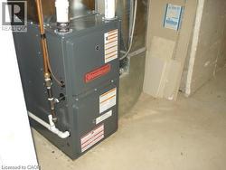 Utility room featuring heating unit - 