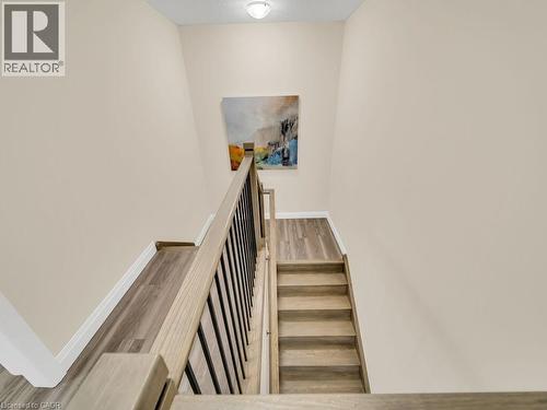 Staircase with wood finished floors and baseboards - 256 W King Street, Ingersoll, ON - Indoor Photo Showing Other Room