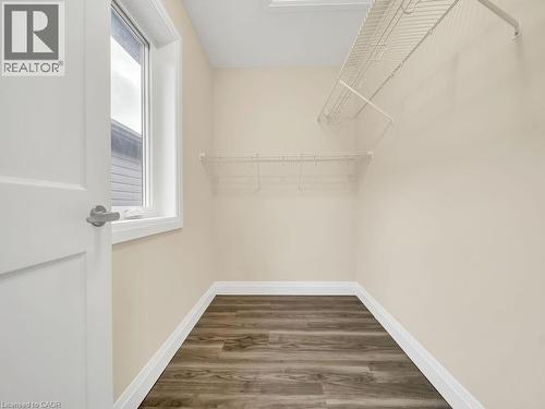 Spacious closet featuring dark wood-style floors - 256 W King Street, Ingersoll, ON - Indoor With Storage