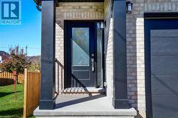 Entrance to property with stone siding - 