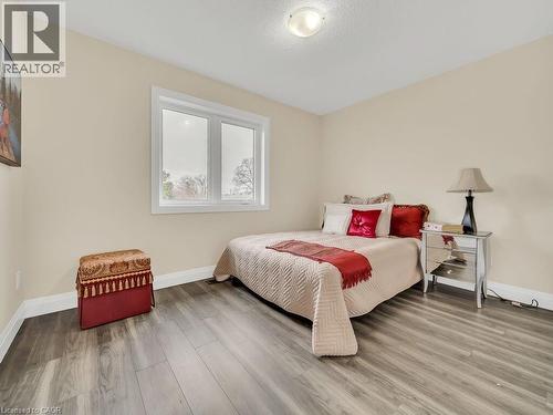 Bedroom featuring light wood finished floors and a textured ceiling - 256 W King Street, Ingersoll, ON - Indoor Photo Showing Bedroom