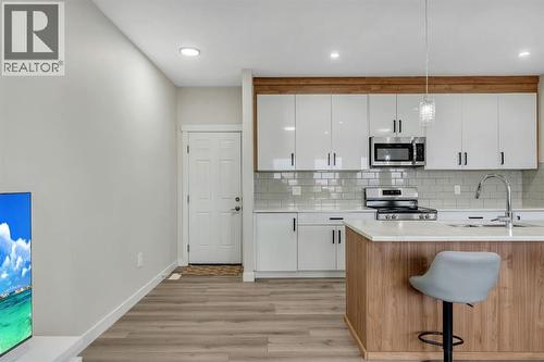 1222 Westmount Drive, Strathmore, AB - Indoor Photo Showing Kitchen With Double Sink With Upgraded Kitchen