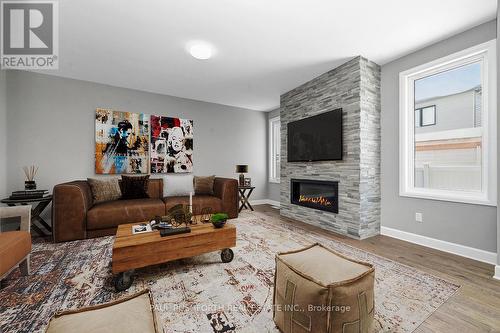 Virtually Staged-Family Room - 147 Aquarium Avenue, Ottawa, ON - Indoor Photo Showing Living Room With Fireplace