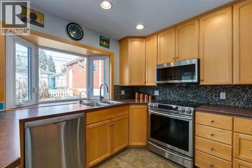 55 Heston Street Nw, Calgary, AB - Indoor Photo Showing Kitchen With Double Sink