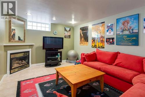 55 Heston Street Nw, Calgary, AB - Indoor Photo Showing Living Room With Fireplace