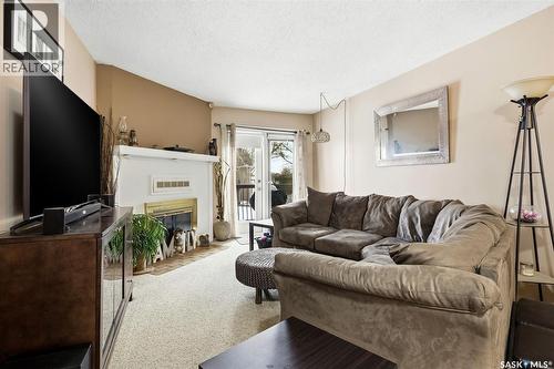114 Cedar Meadow Drive, Regina, SK - Indoor Photo Showing Living Room With Fireplace