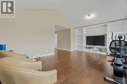 Custom built entertainment unit and shelves - 113 Aspen Stone Place Sw, Calgary, AB - Indoor