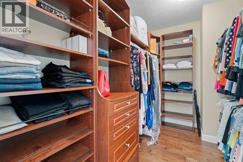 Custom organizers in the primary walk-in closet - 113 Aspen Stone Place Sw, Calgary, AB - Indoor With Storage