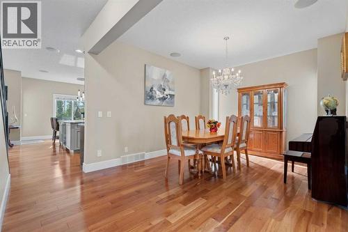 Beautiful cherry wood floors - 113 Aspen Stone Place Sw, Calgary, AB - Indoor Photo Showing Dining Room