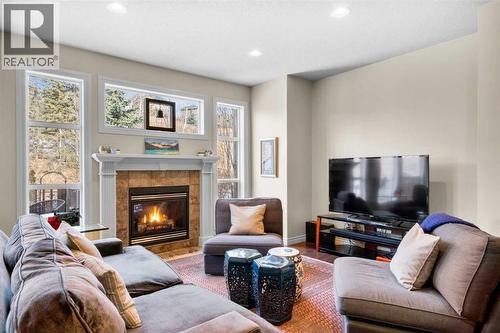 90 Discovery Ridge Gardens Sw, Calgary, AB - Indoor Photo Showing Living Room With Fireplace