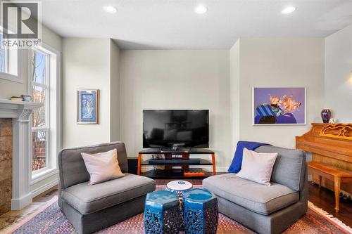 90 Discovery Ridge Gardens Sw, Calgary, AB - Indoor Photo Showing Living Room With Fireplace