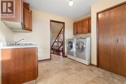 39 Coach Gate Way Sw, Calgary, AB - Indoor Photo Showing Laundry Room