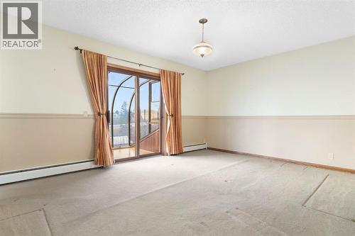 Primary bedroom - 39 Coach Gate Way Sw, Calgary, AB - Indoor Photo Showing Other Room