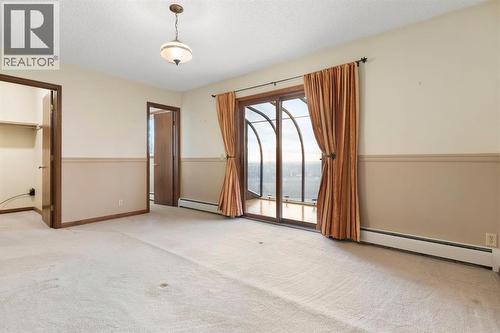 Primary bedroom - 39 Coach Gate Way Sw, Calgary, AB - Indoor Photo Showing Other Room