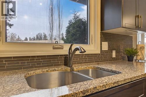 68 Bermondsey Rise Nw, Calgary, AB - Indoor Photo Showing Kitchen With Double Sink