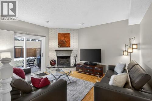 68 Bermondsey Rise Nw, Calgary, AB - Indoor Photo Showing Living Room With Fireplace